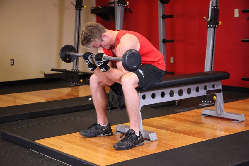 Seated Close-Grip Concentration Barbell Curl - ending position