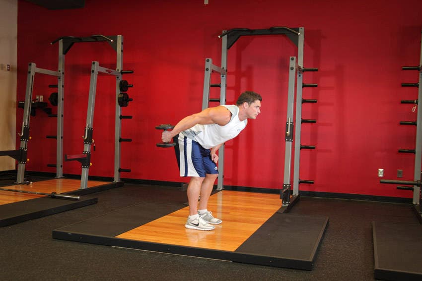 Standing Bent-Over One-Arm Dumbbell Triceps Extension - ending position