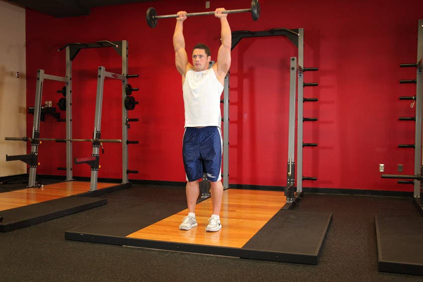 Standing Front Barbell Raise Over Head - ending position