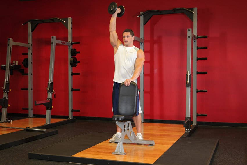 Standing Palm-In One-Arm Dumbbell Press - ending position