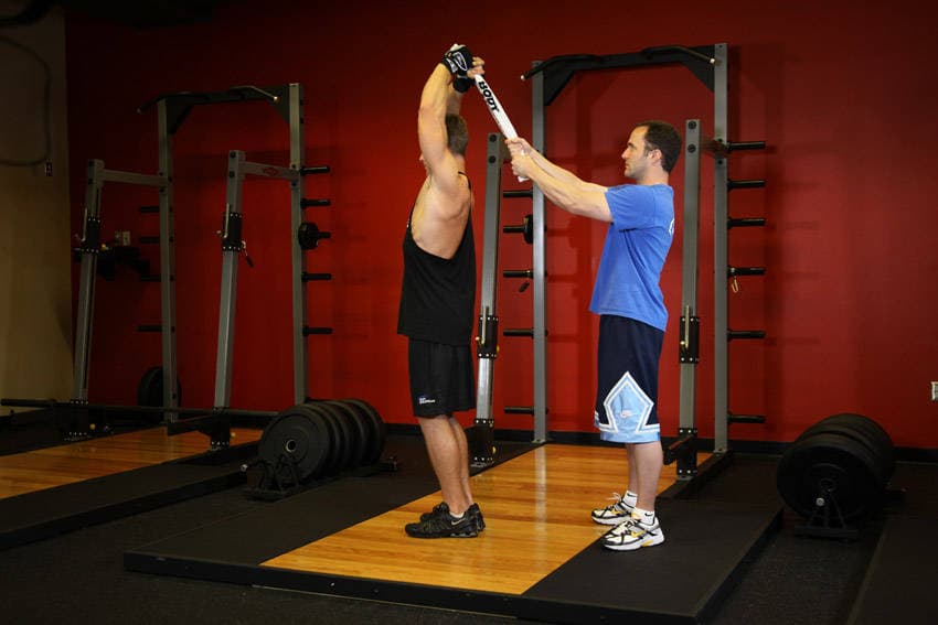 Standing Towel Triceps Extension - ending position
