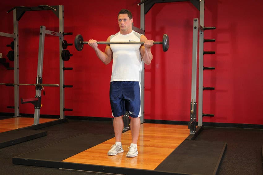 Wide-Grip Standing Barbell Curl - ending position